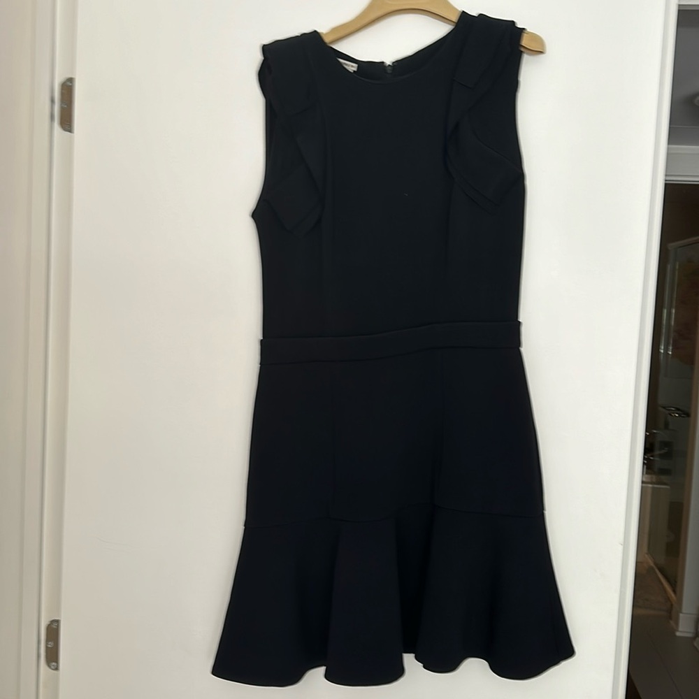 Authentic Miu Miu dress beautiful detail along the shoulders and hem.